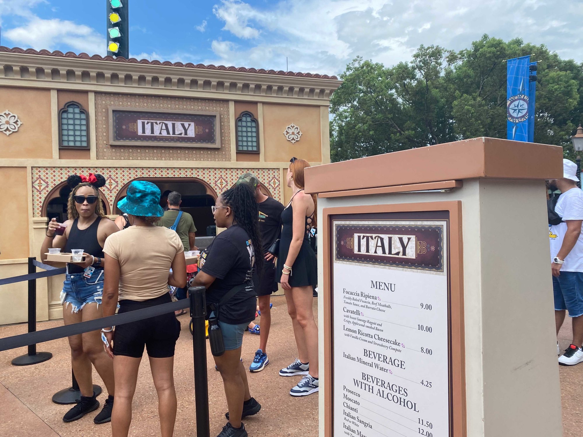 italy booth with line of people and outdoor menu
